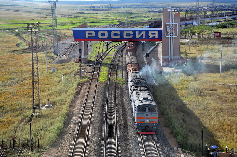Russian diesel locomotive 2TE10M-2766 with freight train from Russia to China