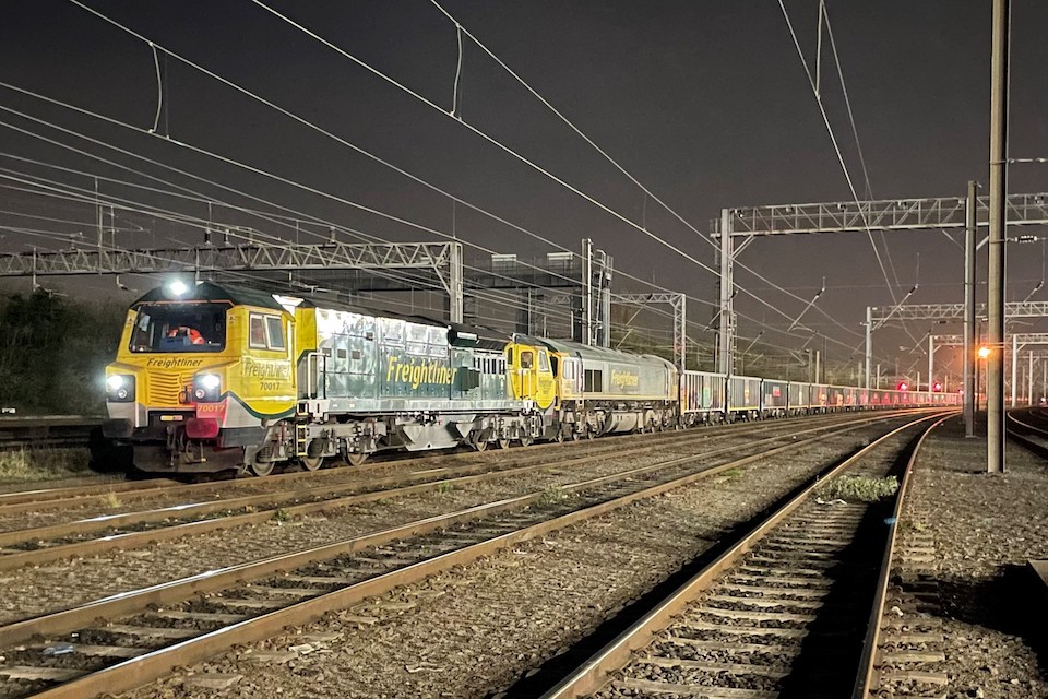 Night shot of Tarmac 'jumbo train' hauled by Freightliner