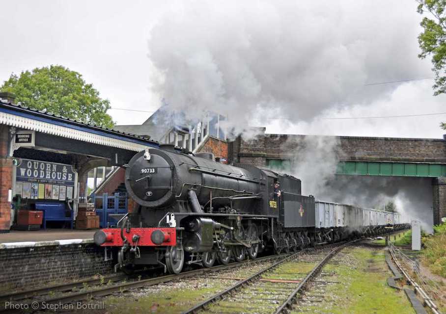 Steam locomotive approaching with a goods train on the Great Central Railway